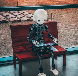 robot sitting on a bench