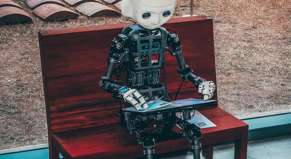 robot sitting on a bench