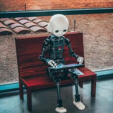 robot sitting on a bench